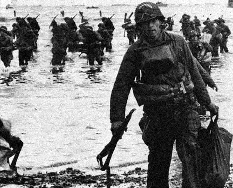 Soldiers walking into shore