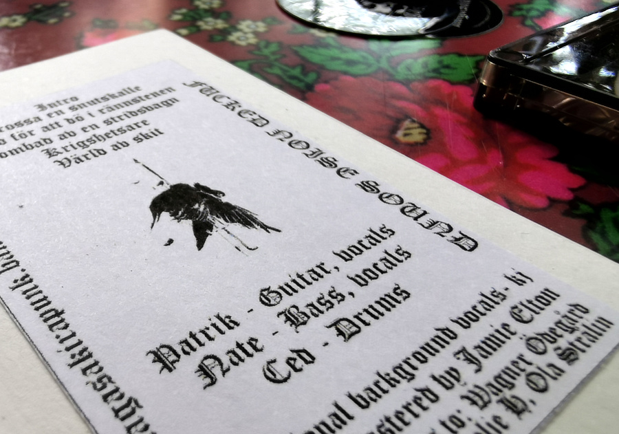 A closeup shot of the inside, a tracklist and credits