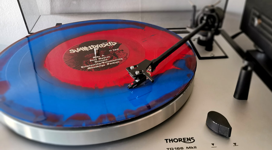 The limited edition of the vinyl playing on a turntable