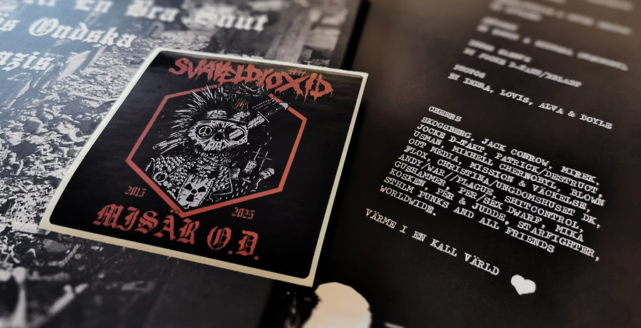 Close up photo of the artwork, sleeve and sticker